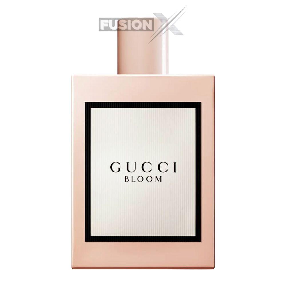 Gucci Bloom Eau de Parfum 100ml bottle on a vanity table.
