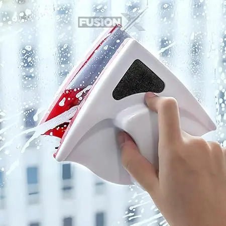 "Magnetic window cleaner brush in action on large glass window"
